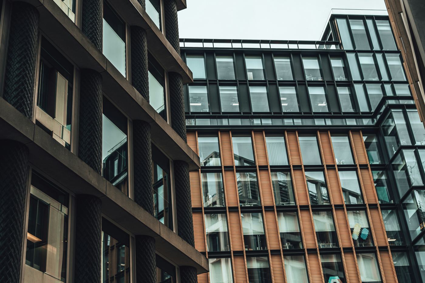 Modern office buildings with glass and terracotta facades